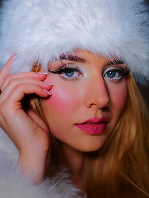 A stylish girl flaunting cold girl makeup, highlighting shimmering icy tones and a fresh, wintery aesthetic.