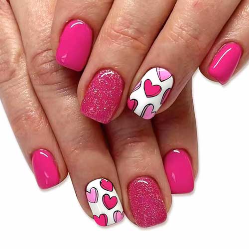 Cute Valentine's Day press-on nails featuring heart designs, short square shape, and glitter. 24 pieces for a stylish look!