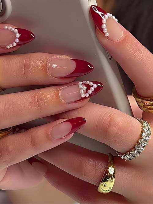 Dark red French tip valentine press on nails in a short almond shape, perfect for a stylish Valentine's Day look.