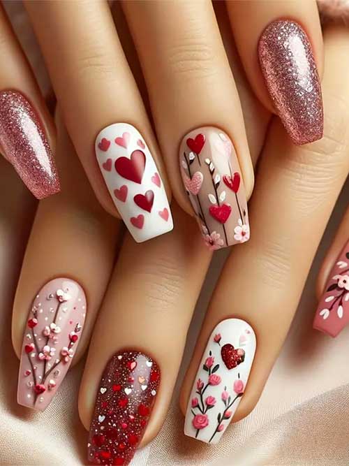 Glossy red heart and flower design press-on nails for Valentine's Day, featuring sparkly full coverage in a coffin shape.