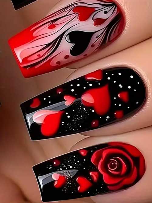 Stylish medium-length black acrylic nails with red heart rose patterns, perfect for a cute Valentine's Day manicure.