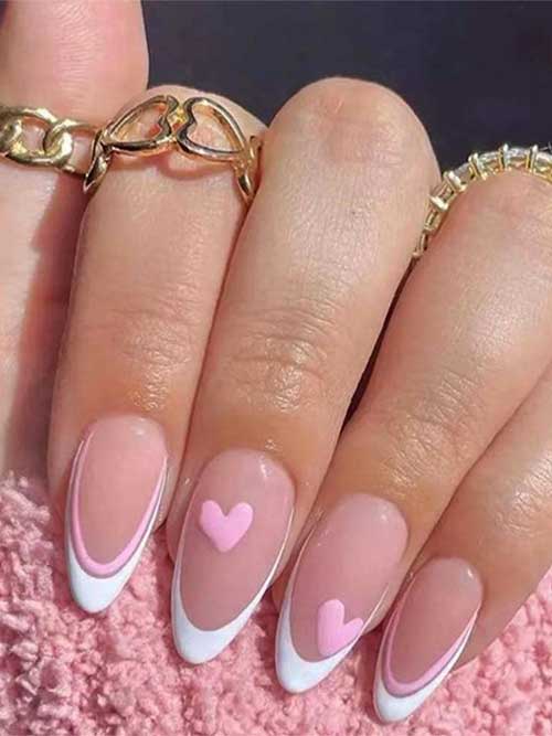 White almond press-on nails with pink hearts and French tips, perfect for weddings. Reusable and stylish for any occasion.