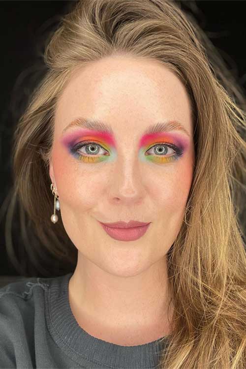 A vibrant layered eyeshadow design with multiple textures and colors, ideal for adding depth and drama to spring makeup.