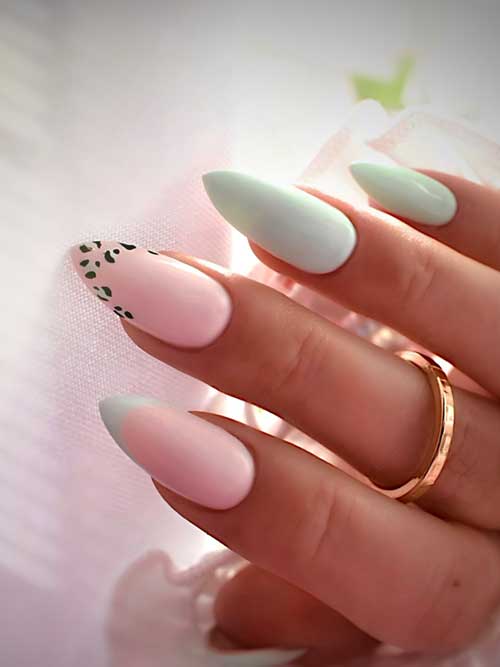 Elegant long almond-shaped blush pink and mint green nails, with playful leopard print accents on the index finger.